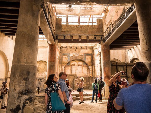 Herculaneum Private Tour with an Archaeologist - Stop 5 to Stop 7: the Black Room, the charred boat, and frescoed myth at the College of the Augustales