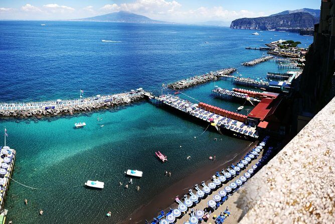 Private Day Tour of Pompeii, Sorrento and Positano with Pick Up - Positano on the Amalfi Coast: church dome, main beach, and town views